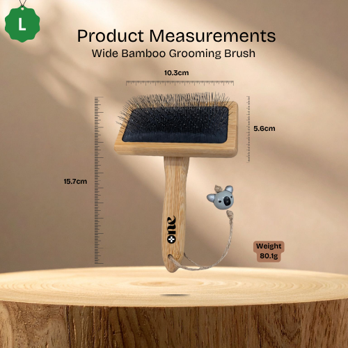 Wide Bamboo Grooming Brush with measurements on a wooden surface