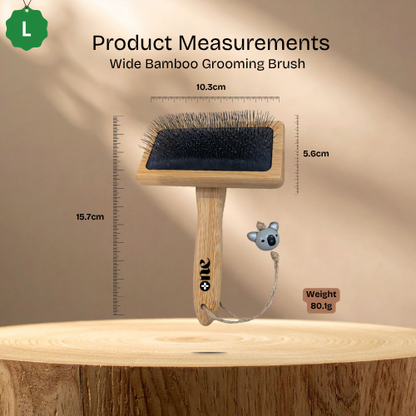 Wide Bamboo Grooming Brush with measurements on a wooden surface