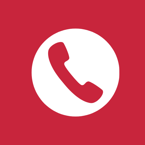 White telephone icon on a red background